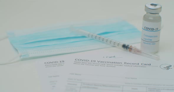 Medical Mask and COVID19 Vaccine on Vaccination Record Card Approved By CDC with Corona Virus alt