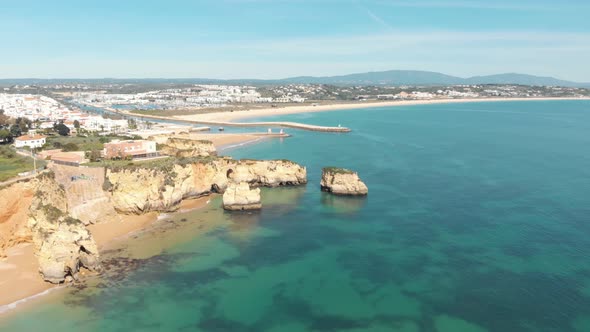 Mouth of Ribeira de Bensafrim, Lagos, Algarve. Aerial forward alt