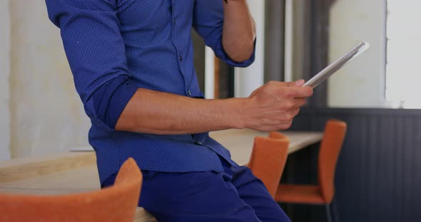 Businessman using digital tablet in modern office 4k