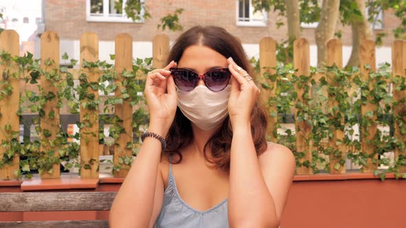 Tourist Using Medical Mask Protection to Protect Herself From Coronavirus and Covid19 During Travel alt