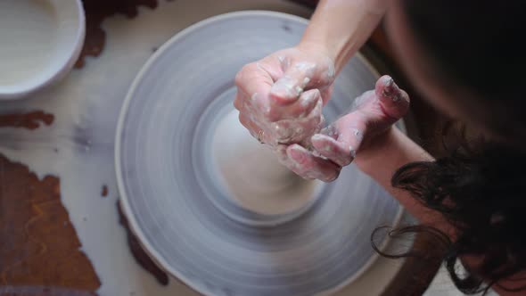 Handmade Ceramic Production Woman is Working with Pottery Wheel alt