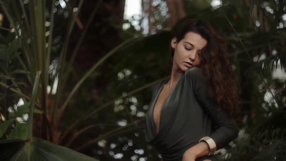 Woman Standing in the Tropical Jungle at Summer alt