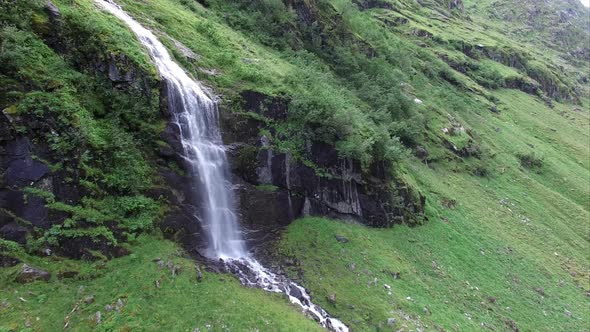 Aerial view of picturesque small waterfall