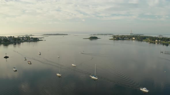 Sunrise Aerial Drone Flyover of Suburban Harbor with Boats (Norwalk, Connecticut)