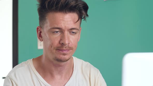 Portrait of a Young Man Concentrate Stressed Tension While Working at Home alt