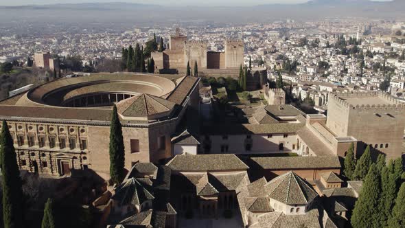 Aerial forward over monumental complex of Alhambra citadel. Andalucia in Spain