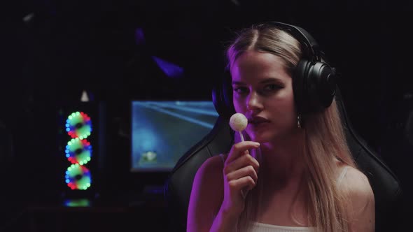 Blonde Flirty Gamer Girl Streamer Licking a Lollipop alt