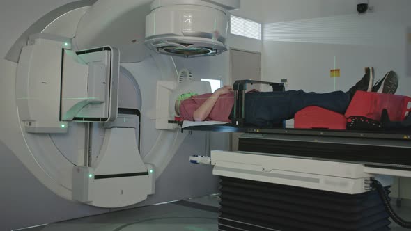 Patient Getting Radiation Therapy Treatment Inside A Modern Radiotherapy Room alt