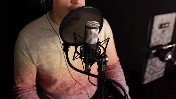 A Professional Announcer Makes a Recording in the Studio