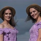 Portrait Two Young Twin Girls in Identical Dresses Looking in Camera in Nature - VideoHive Item for Sale