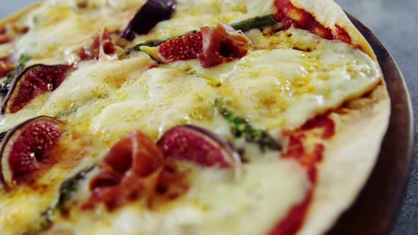 Baked pizza with fig toppings alt