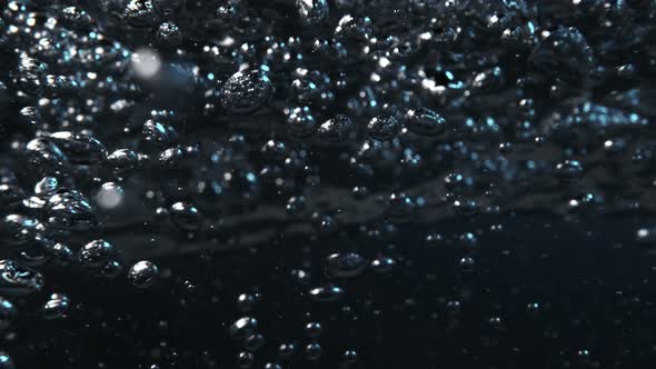Super Slow Motion Macro Shot of Air Bubbles Flowing in Water at 1000 Fps alt