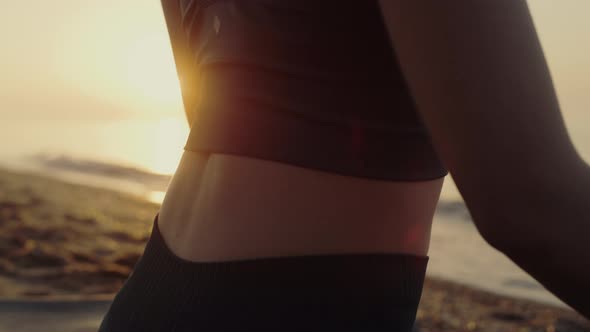 Sporty Woman Sitting Lotus Position Practicing Yoga Asana at Sunset Close Up alt