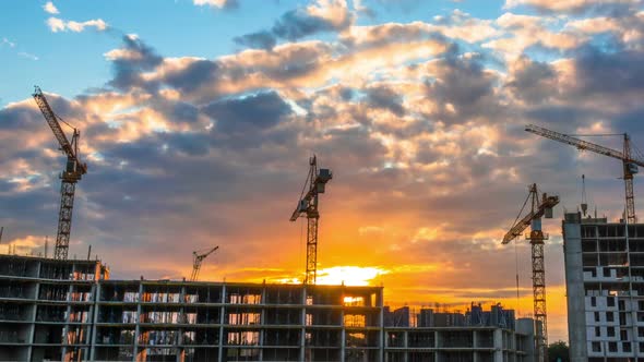 Time Lapse Footage of a Big Construction Site with Several Working Cranes alt