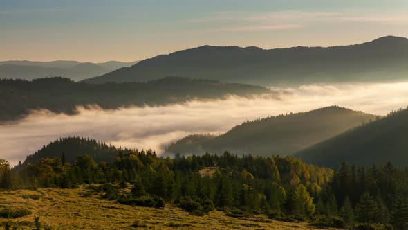 Misty Dawn in the Mountains. Beautiful Autumn Landscape