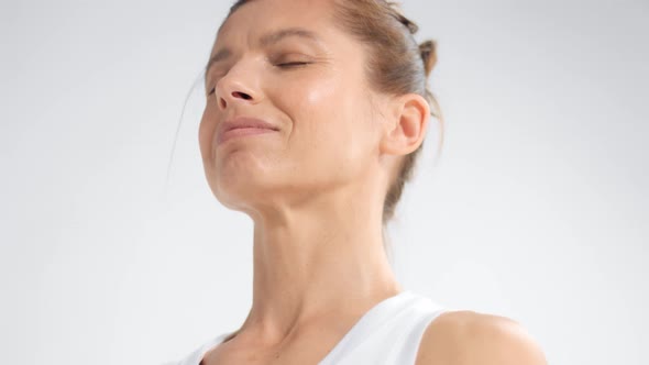 Senior Woman in White Space Practice Yoga Closeup Portrait