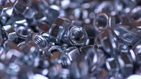 Metal Screwnuts Fall Neatly Into a Bunch of Other Nuts alt