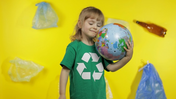 Girl Activist Makes Earth Globe Free From Plastic Package. Reduce Trash Pollution. Save Ecology alt