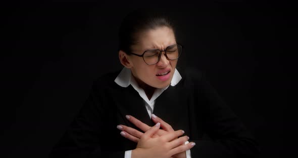 Business Lady with Glasses Suffers From Chest Pain at Work