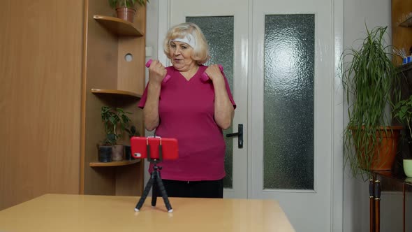 Old Senior Grandmother Woman Doing Workout with Dumbbells Training Fitness Sport Activity at Home alt