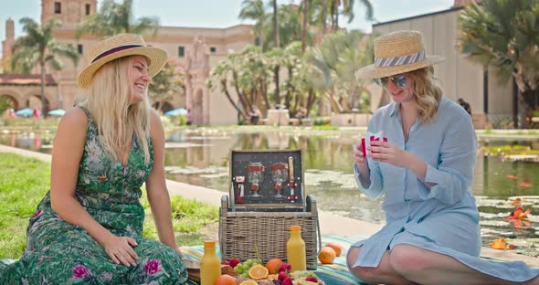 Happy Amazed Young Caucasian Young Woman Receiving and Opening Red Box with Gift alt