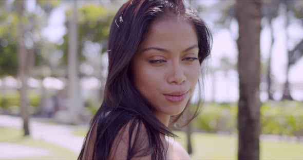 Sensual Asian Woman with Naked Shoulder Looking at Camera alt