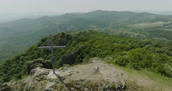 Calm, natural panorama and an old cross on top of the Azeula Fortress. alt