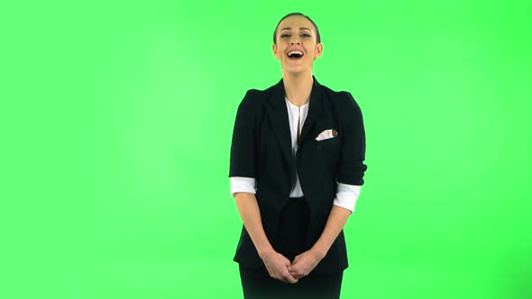 Girl Listens Carefully Then Bursts Into Laughter. Green Screen alt