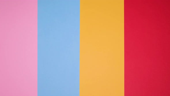 Small Vintage Retro Toy Cars on a Pink Yellow Blue Background alt