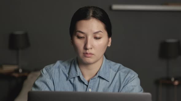 Asian woman stretching body and yoga in living room at home. Activity during quarantine alt