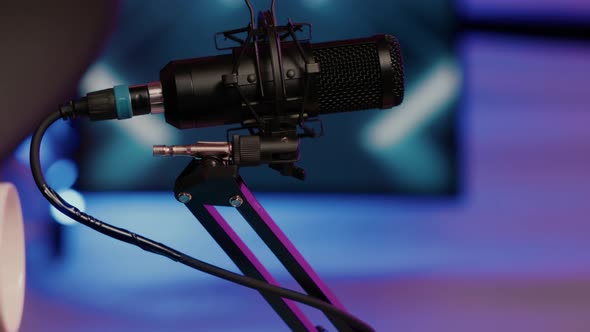 Selective Focus on Professional Boom Arm Microphone Stand Used for Recording Voice in Online Podcast alt