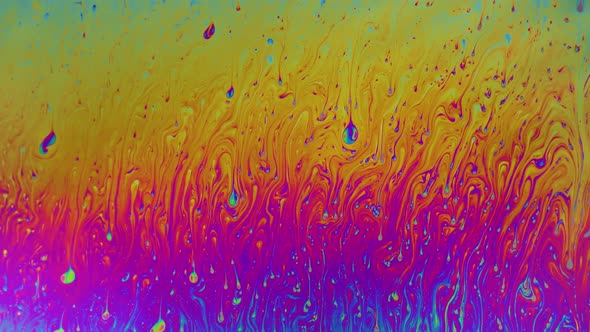 Macro soap bubble creates a colorful and psychedelic background alt