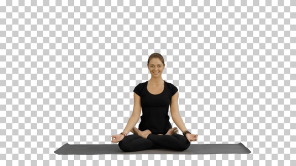 Young woman meditates while practicing yoga, Alpha Channel