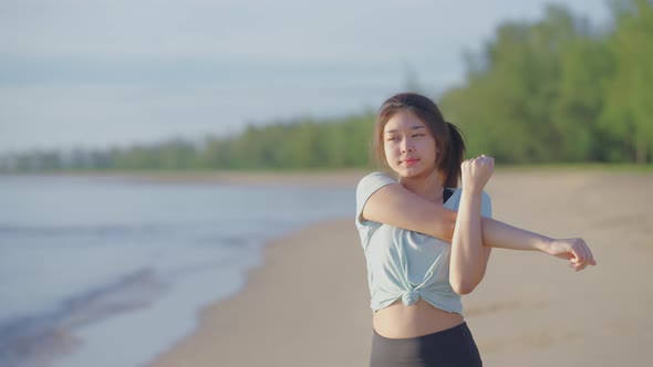 Asian cute girl She was walking and stretching before her morning run