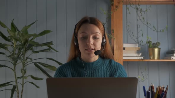 Woman Sit at Desk Wear Headphones Talk with Teacher Study Online