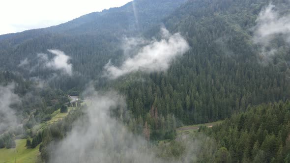 Fog in the Mountains. Aerial View of the Carpathian Mountains in Autumn. Ukraine alt