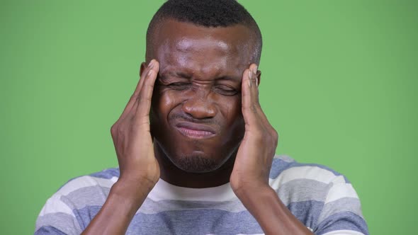 Young African Man Having Headache alt