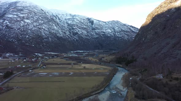 Flying over popular Laerdal salmon river during winter off season with low water level alt