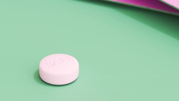 Pink birth control pill on a green table. Pills in a feminine  blister. 4KHD
