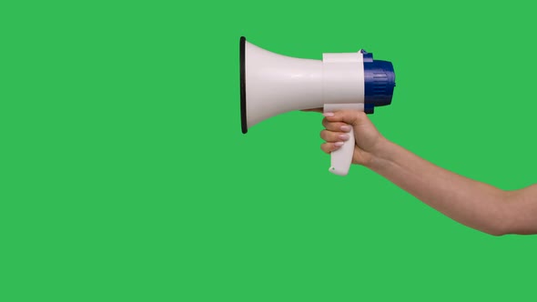 Megaphone Close Up Rised in Female Hand on Green Screen Chroma Key Background alt