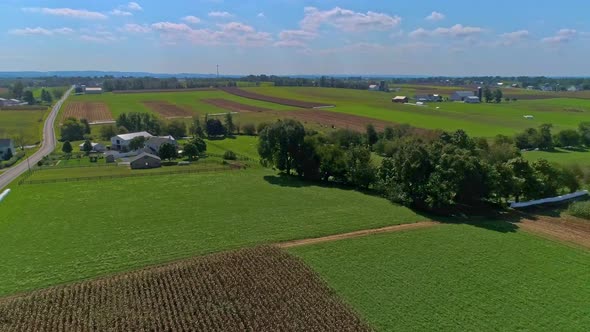 Aerial View of Rural America of Amish Farmlands With Fields Needing Harvesting