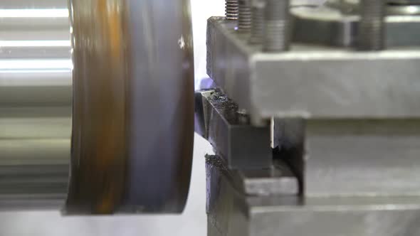 The Operation of Lathe Machine Cutting the Metal Shaft Parts