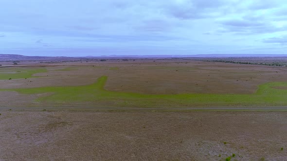 Aerial Drone shot of flying over country road.