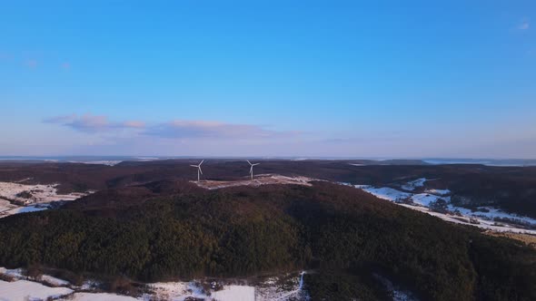 Aerial Drone View Wind Power Turbine on the Horizon Green Energy Concept alt