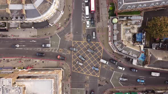 A Drone View From Above of a Busy Intersection with Different Traffic Flows