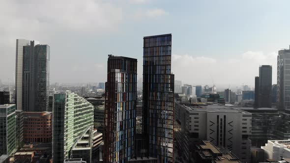 Aerial view of skyscrapers near Liverpool Street Station on a hazy day in London alt