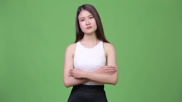 Young Beautiful Asian Businesswoman with Arms Crossed