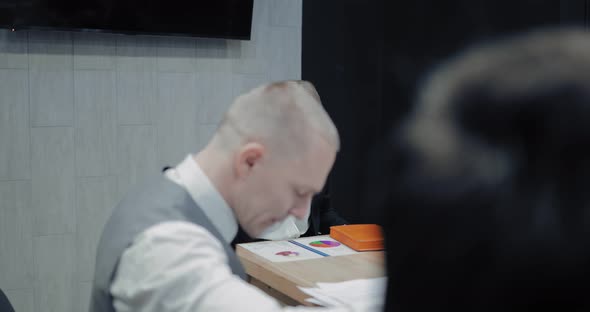 Beautiful Boss Sits with Her Mouth Taped on a Chair in the Office alt