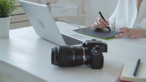 Creative Work and Hobby Concept Middleaged Woman Photo Editor Working on Computer at Her Desk with alt