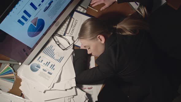 Female Office Worker Sleeping on Desk alt
